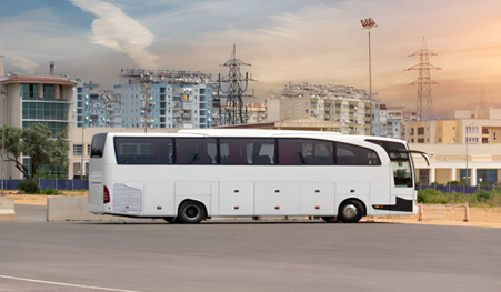 White bus standing in the beautiful streets of Ajman